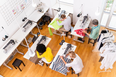 High angle view of fashion designers working at studio