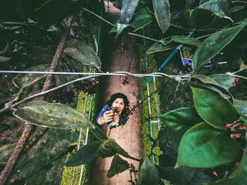 High angle view of woman standing on footpath