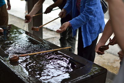 Low section of people working in water