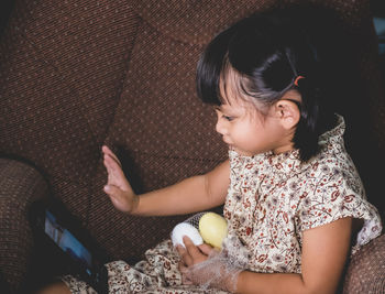 High angle view of woman using mobile phone