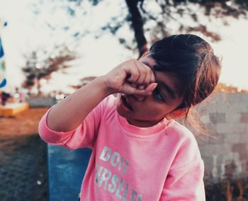 Portrait of girl standing outdoors