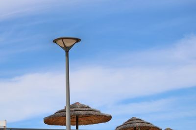 Low angle view of street light against sky