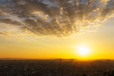 Cityscape against sky during sunset