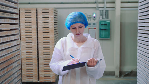 Portrait of young woman working in office