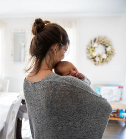 Rear view of mother and daughter