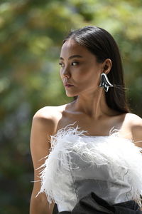 Portrait of young woman looking away