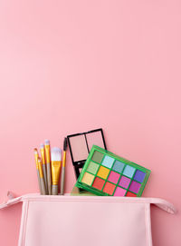 Close-up of books against pink background