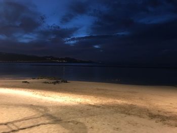 Scenic view of beach against sky during sunset