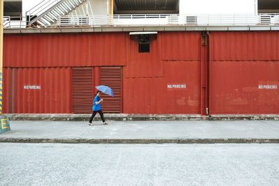 Woman standing in front of building