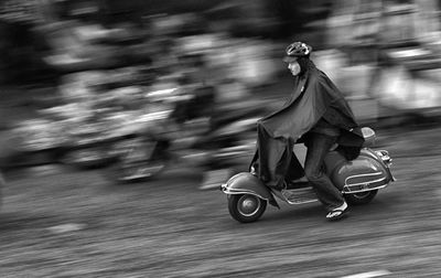 Man riding motorcycle on street