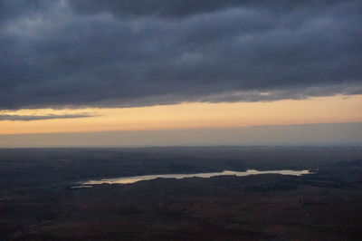 Scenic view of dramatic sky over land