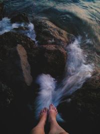 Low section of person in sea