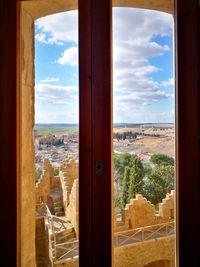 Panoramic view of city seen through window