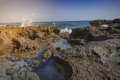 Scenic view of beach against clear sky