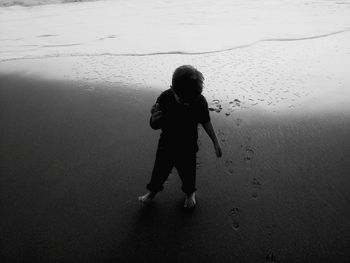 Full length of girl standing on railing