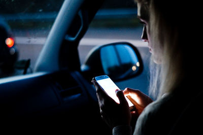 Man using mobile phone in car