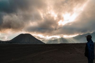 View of a desert against cloudy sky