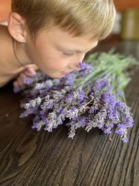 Close-up of girl with purple flower