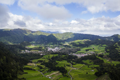 Scenic view of landscape and mountains against sky