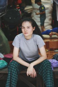 Portrait of a smiling woman sitting on seat