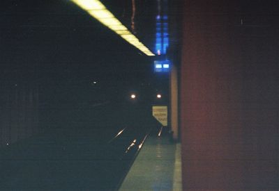 Illuminated road in city at night