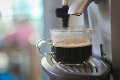 Close-up of coffee cup on table