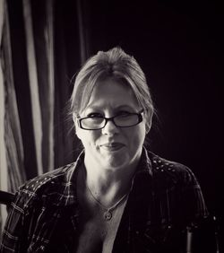 Close-up portrait of smiling mature woman at home