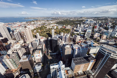 Aerial view of modern buildings in city against sky