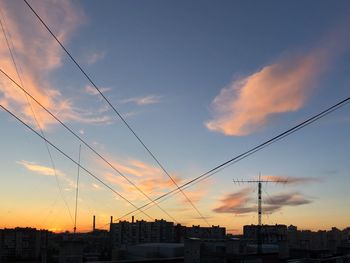 Low angle view of silhouette buildings against sky during sunset