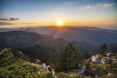 Scenic view of mountains against sky during sunset