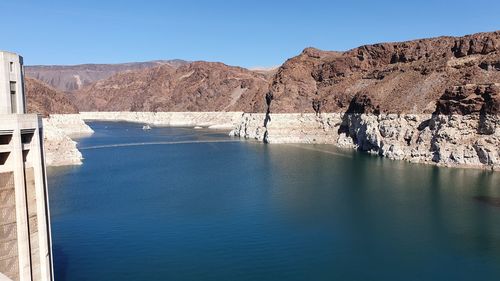 Scenic view of lake against clear blue sky