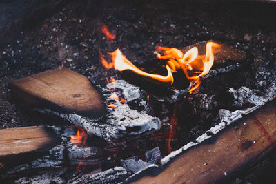 High angle view of fire on wood