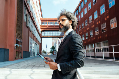 Portrait of young man using mobile phone