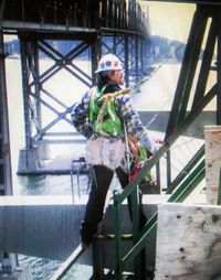 Man standing on railing