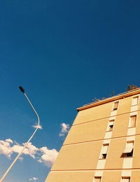 Low angle view of building against blue sky