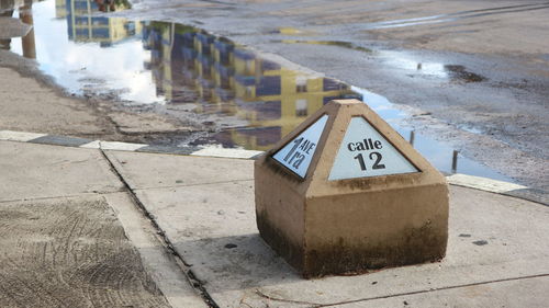 Road sign on wet street