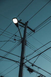 Low angle view of street light against sky
