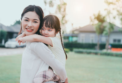 Portrait of happy mother and baby girl