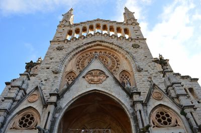 Low angle view of historic church against sky. soller, majorca, spain.
