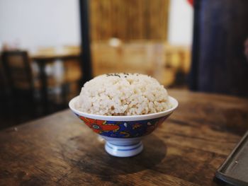 Close-up of rice in bowl on table