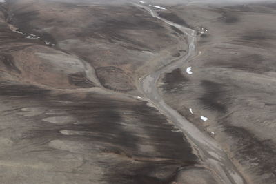 High angle view of water flowing through rocks