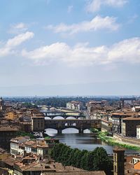 High angle view of bridge over river against buildings in city