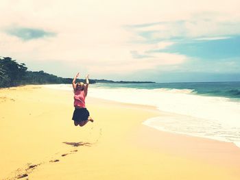 Full length of man on beach against sky