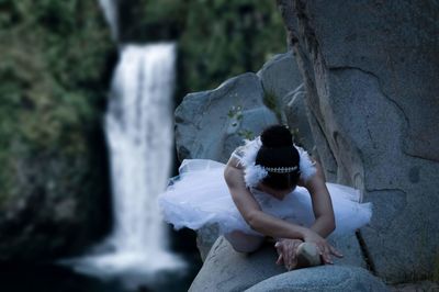 High angle view of ballet dancer on rock