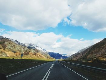 Surface level of road against mountain range