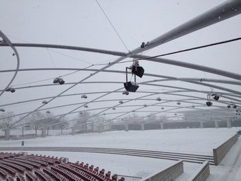 Overhead cable car against sky during winter