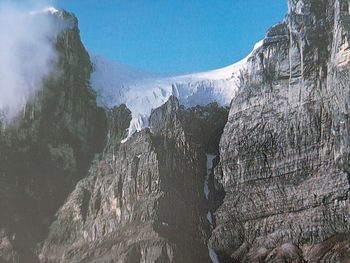 Panoramic view of snowcapped mountains against sky