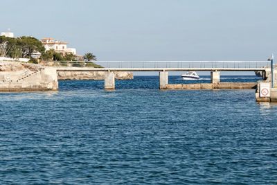 Bridge over sea against sky