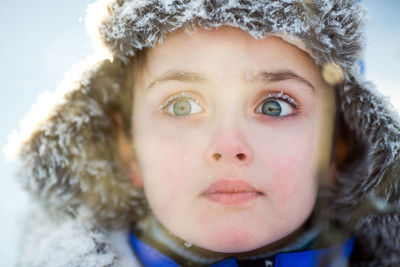 Portrait of a boy 6 years old in winter