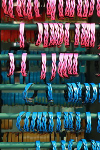 Close-up of bracelets hanging on rack at market